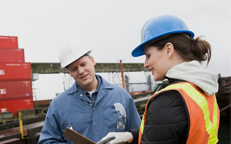 Workers in safety gear at construction site