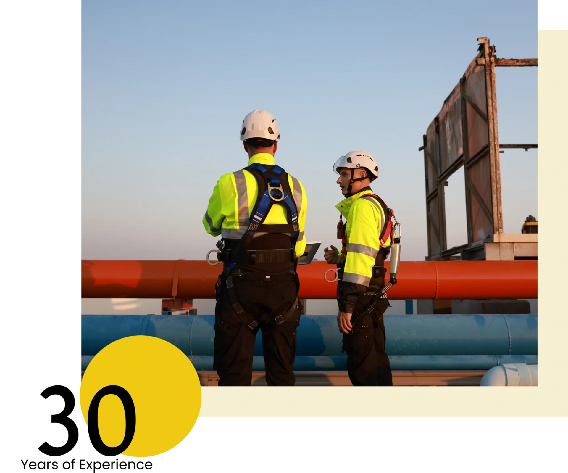 Construction workers inspecting pipelines